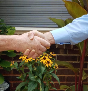 Photo by Senia Owensby Wayne and our son Adam shake hands