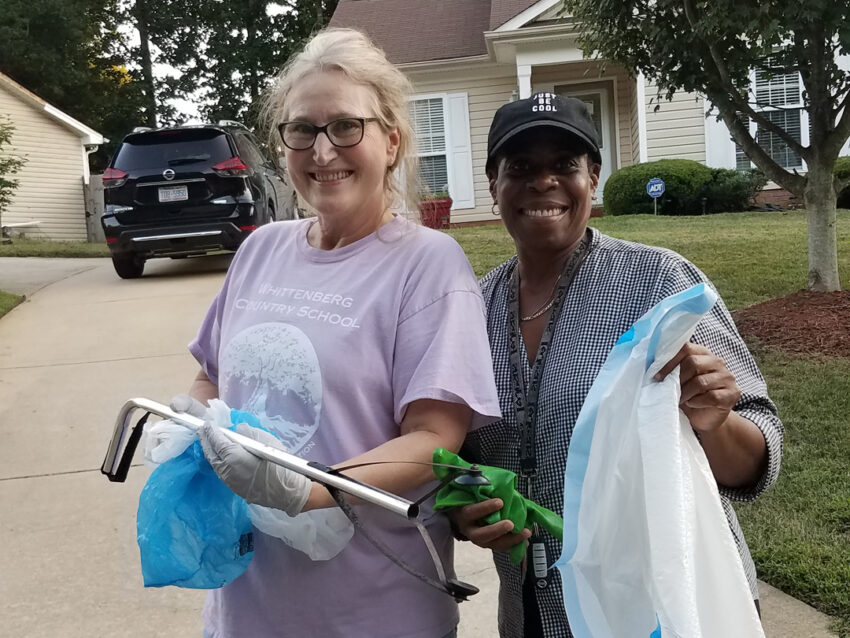 My neighbor Jackie and I show off our ‘litter-pick-up’ tools we take with us on our walks.