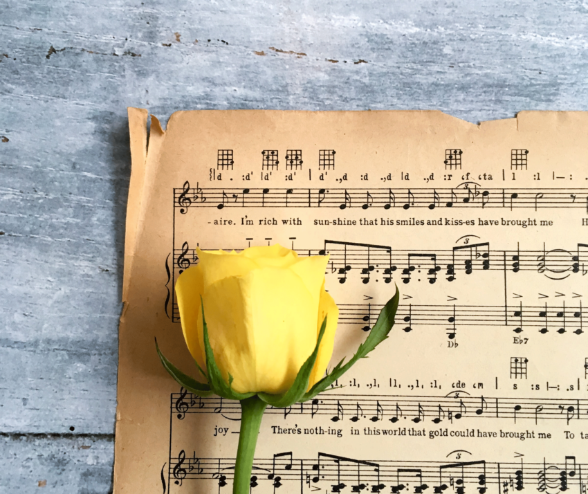 This photo reminds me of Mama, her favorite color of roses resting on sheet music.