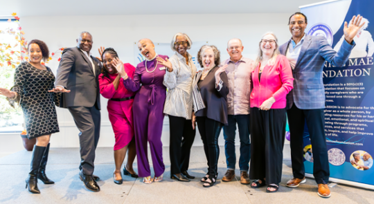Speakers from the first Frankie Mae Foundation fundraiser gather around Venitra for a photo.